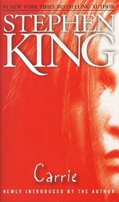 A half of a girl's face is visible on the right side of the cover. Everything is seen through a blood red hue. Author: Stephen King, Title: Carrie. Below the title reads: Newly introduced by the author.